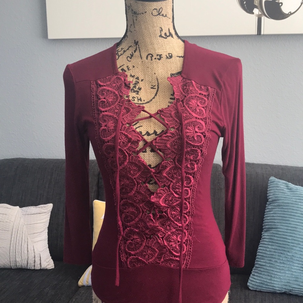 Burgundy lace up bodysuit from Fashion Nova